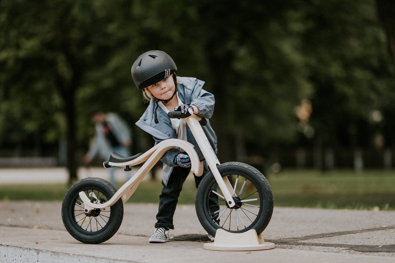 Child riding wooden balance bike on path — Balance Bike 3in1 — AlmaVidaKids