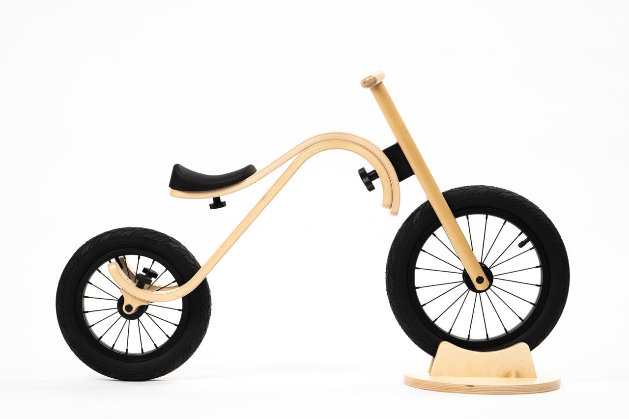 Child on wooden 3-in-1 balance bike in natural setting — Balance Bike 3in1 — AlmaVidaKids