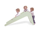 Child playing on green indoor toddler slide — Jupiduu Indoor Slide — AlmaVidaKids